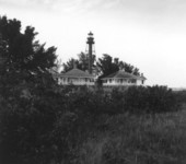Lighthouse and dwellings near the beach - Sanibel Island, Florida
