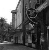 Storefronts of theater and automotive shop - Madison, Florida.