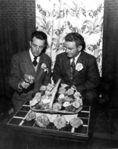 H.G. Champlin and Mack Tripp look over their prize blossoms at a flower show - Pensacola, Florida.