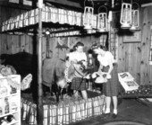 Women playing with Elsie the Borden cow at the Florida State Fair