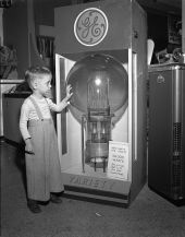 Tommy Dodgen, age 4, standing by the largest lamp in the world - Tampa, Florida