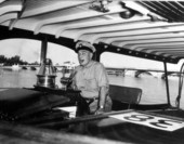 Man with cigar cruising aboard the Southward Ho - Palm Beach, Florida