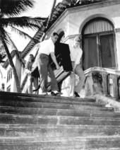 Men carrying a large piece of furniture bought from the Stotesbury auction - Palm Beach, Florida