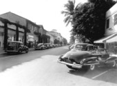 Cars parked along Worth Avenue - Palm Beach, Florida.