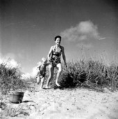 Mrs. Thomas Ferris and her son Timothy at the beach