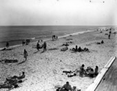People enjoying the sun and surf.