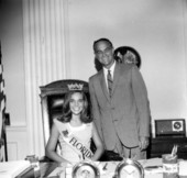 Miss Florida 1968, Linda Fitts sitting at a desk in the Florida Hotel and Restaurant Commission - Tallahassee, Florida