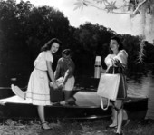 Mr and Mrs. Wesley McClure and Miss Mary Freda Mosby unload a boat - Citrus County, Florida .