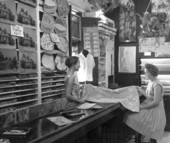 Employee and consumer looking over fabric - Key West, Florida