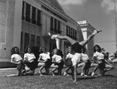 Beverly Parker does a cartwheel in front of other cheerleaders - Key West Florida