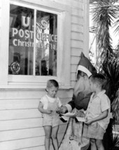 Lewis and Stanley Yates give Santa a helping hand - Christmas, Florida