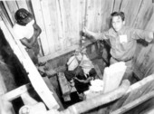 George B. Mobley and J. T. Conway on a makeshift elevator - Green Cove Springs, Florida