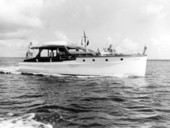 People on deck of a small yacht