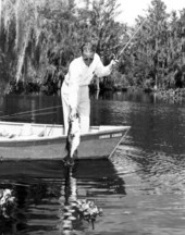 O. A. Barry landing an 8 pound bass - Cross Creek, Florida