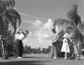 Men playing golf at a golf course