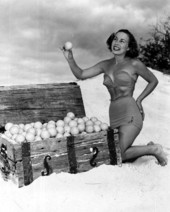 Ann Williamson in a beach scene, posing with orange-filled treasure chest - Winter Haven, Florida