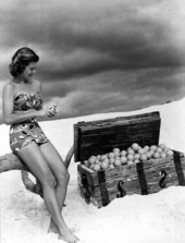 Jane Strickland in a beach scene, posing with orange-filled treasure chest - Winter Haven, Florida