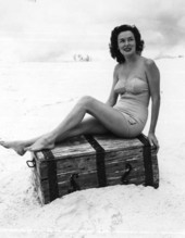Margie Fletcher in a beach scene, posing on top of a treasure chest - Winter Haven, Florida