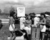 Young ladies serving oranges and orange juice at contest - Orlando, Florida.