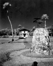 View of memorial with block house visitors' center in background at the Collier-Seminole State Park - Collier County, Florida