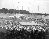 Crowd watching acrobats perform at the watermelon festival carnival - Leesburg, Florida