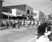 Crowd watching marching band in the parade at the watermelon festival - Leesburg, Florida