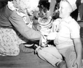 Young boy and clown at the watermelon eating contest in the watermelon festival - Leesburg, Florida