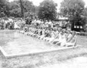Beauty contestants seated at the edge of a pool in the watermelon festival - Leesburg, Florida
