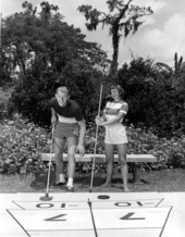 Couple play shuffleboard at Cypress Gardens - Winter Haven, Florida