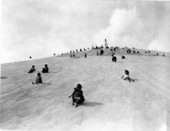 Visitors play on a mountain of sand - Fort Meade, Florida