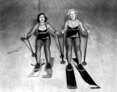 Two young women ski the mountain of sand - Fort Meade, Florida .