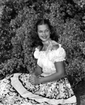 Dorothy Pugh poses in a dress with bougainvillea vine - Cypress Gardens, Florida
