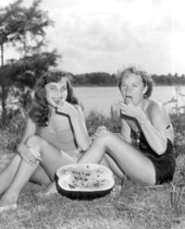 Carolyn Vaughn and Carol Cox enjoy a slice of watermelon at the watermelon festival - Leesburg, Florida