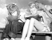 Two young girls participating in a watermelon eating contest at the watermelon festival - Leesburg, Florida