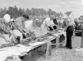 Men cutting ribs for the Mathews Bridge barbecue - Jacksonville, Florida.