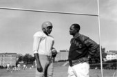 FAMU coach Jake Gaither with a football player during practice - Tallahassee, Florida.
