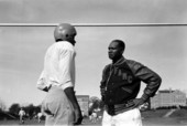 FAMU coach Jake Gaither with a football player during practice - Tallahassee, Florida.