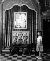 Child looking at poster portraits of Ringling Brothers and Barnum and Bailey- Sarasota, Florida.