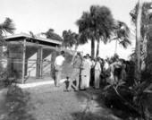 Members of the Inter-American Tourism Conference in front of a birdhouse at the Miami Rare Bird Farm - Kendall, Florida