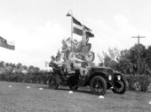 Carlos V. Pellerano of the Dominican Republic riding in an antique car from the James Melton Autorama - Hypoluxo, Florida