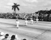 Young girls carrying a banner in the Gasparilla festival parade - Tampa, Florida.