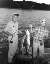 Two men proudly displaying their barracudas - Dry Tortugas, Florida.