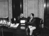 Governor Collins and unidentified man with the Leesburg Festival prize winning watermelon - Tallahassee, Florida.