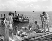 Herb Alley dives for Florida lobster and shells for the amusement of his guests - Tavernier, Florida.