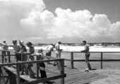 People fishing and watching on the pier during the Destin Rodeo - Destin, Florida