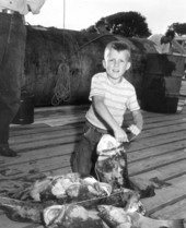 A boy and his large catch of fish at the Destin Rodeo - Destin, Florida