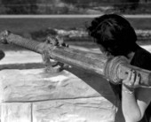 A woman aiming a swivel gun atop the McKee's Museum of Sunken Treasure - Plantation Key, Florida