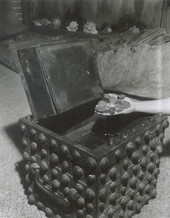 A handful of silver coins and a treasure chest displayed at McKee's Museum of Sunken Treasure - Plantation Key, Florida
