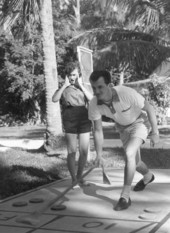Lyn and Jim Agramonte playing shuffleboard during their honeymoon - Sanibel Island, Florida.