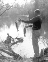 Andy Harrold shows off his chipola bass catch to Floyd Miller - Marianna Region, Florida.